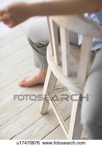 Man who sit on a chair reversely View Large Photo Image Stock Photograph - Man who sit on a chair reversely. Fotosearch