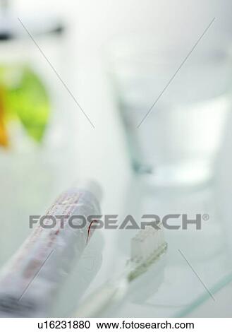 Stock Image - Toothbrush and Toothpowder. Fotosearch