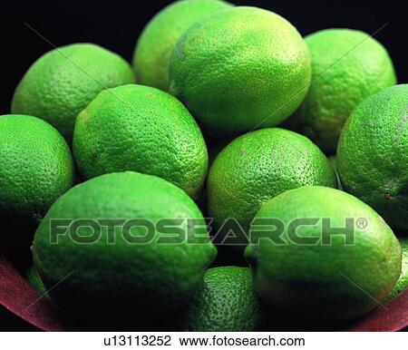 Stock Image - fruit, fresh, green lemon, sour. Fotosearch