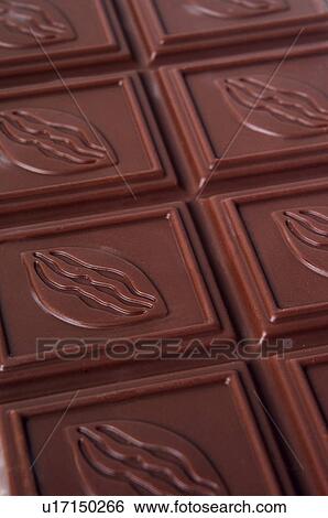 Stock Photograph - Chocolate, Chocolate bar, Black chocolate, Chocolate square, Chocolate squares, Close up, Background. Fotosearch