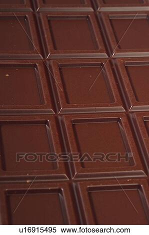 Stock Photography - Chocolate, Chocolate bar, Black chocolate, Chocolate square, Chocolate squares, Close up, Background. Fotosearch