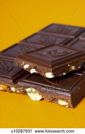 Stock Photo - Chocolate, Chocolate bar, One, Black chocolate, Chocolate square, Chocolate squares, Hazelnut. Fotosearch