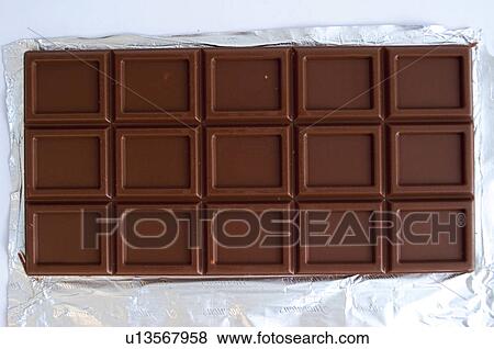 Stock Photo - Chocolate, Chocolate bar, One, Black chocolate, Chocolate square, Chocolate squares, Aluminium foil. Fotosearch