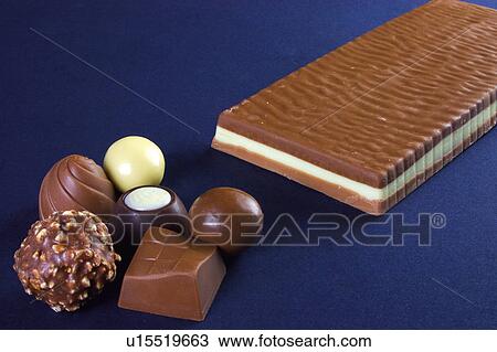 Chocolate, Chocolates, Black chocolate, White chocolate, Chocolate with almonds, Chocolate bar, Nougat candy View Large Photo Image Stock Image - Chocolate, Chocolates, Black chocolate, White chocolate, Chocolate with almonds, Chocolate bar, Nougat candy. Fotosearch