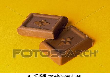 Stock Photo - Chocolate, Two, Black chocolate, Chocolate square, Chocolate squares, Chocolate milk. Fotosearch