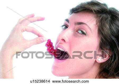 Woman, Brown hair, Beauty, White undershit, White, Red Currant Berry, Opening mouth View Large Photo Image Picture - Woman, Brown hair, Beauty, White undershit, White, Red Currant Berry, Opening mouth. Fotosearch