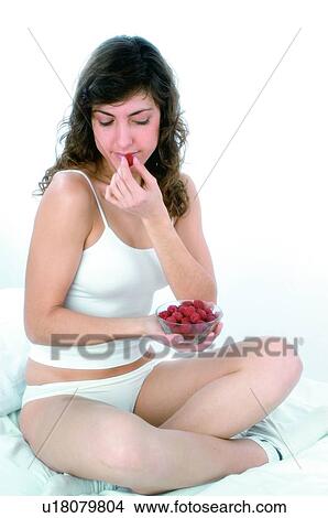 Woman, Brown hair, Beauty, White undershit, White, Red Currant Berry, Opening mouth View Large Photo Image Picture - Woman, Brown hair, Beauty, White undershit, White, Red Currant Berry, Opening mouth. Fotosearch