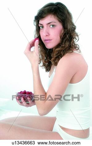 Woman, Brown hair, Beauty, White undershit, White, Red Currant Berry, Opening mouth View Large Photo Image Stock Image - Woman, Brown hair, Beauty, White undershit, White, Red Currant Berry, Opening mouth. Fotosearch