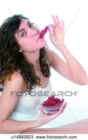Woman, Brown hair, Beauty, White undershit, White, Red Currant Berry, Opening mouth View Large Photo Image Stock Image - Woman, Brown hair, Beauty, White undershit, White, Red Currant Berry, Opening mouth. Fotosearch