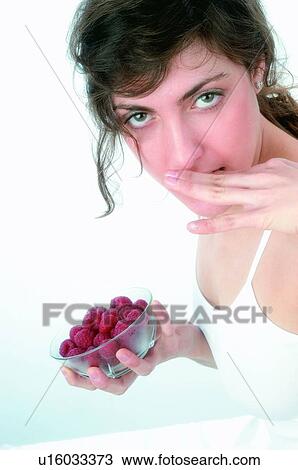 Woman, Brown hair, Beauty, White undershit, White, Red Currant Berry, Opening mouth View Large Photo Image Stock Image - Woman, Brown hair, Beauty, White undershit, White, Red Currant Berry, Opening mouth. Fotosearch