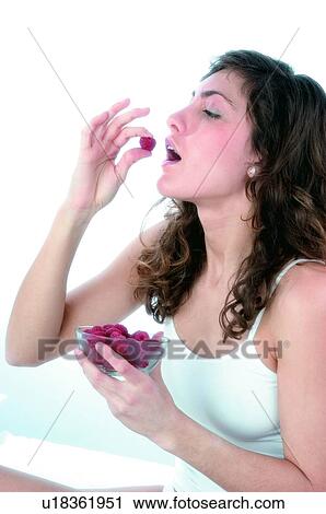 Woman, Brown hair, Beauty, White undershit, White, Red Currant Berry, Opening mouth View Large Photo Image Stock Image - Woman, Brown hair, Beauty, White undershit, White, Red Currant Berry, Opening mouth. Fotosearch