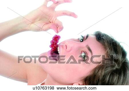 Woman, Brown hair, Beauty, White undershit, White, Red Currant Berry, Opening mouth View Large Photo Image Stock Photo - Woman, Brown hair, Beauty, White undershit, White, Red Currant Berry, Opening mouth. Fotosearch