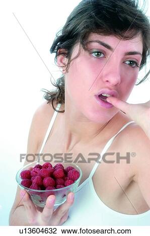 Woman, Brown hair, Ponytail, Beauty, White undershit, Red Currant Berry, Eating View Large Photo Image Stock Image - Woman, Brown hair, Ponytail, Beauty, White undershit, Red Currant Berry, Eating. Fotosearch