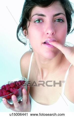 Woman, Brown hair, Ponytail, Beauty, White undershit, Red Currant Berry, Eating View Large Photo Image Stock Image - Woman, Brown hair, Ponytail, Beauty, White undershit, Red Currant Berry, Eating. Fotosearch