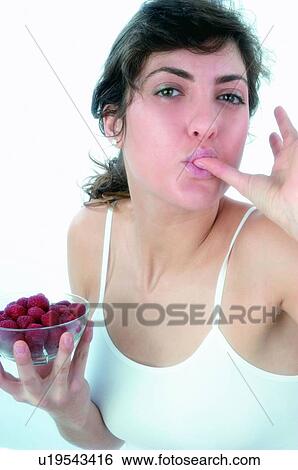 Woman, Brown hair, Ponytail, Beauty, White undershit, Red Currant Berry, Eating View Large Photo Image Stock Photograph - Woman, Brown hair, Ponytail, Beauty, White undershit, Red Currant Berry, Eating. Fotosearch
