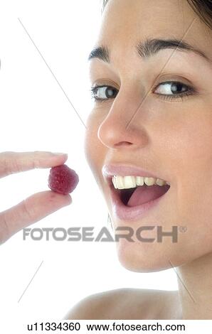 Stock Image - Woman, Beauty, Face, Young, Health, Healthy, Healthy food. Fotosearch