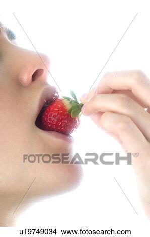 Woman, Brown Hair, Beauty, Eating, Fruit, Strawberry, Mouth View Large Photo Image Picture - Woman, Brown Hair, Beauty, Eating, Fruit, Strawberry, Mouth. Fotosearch