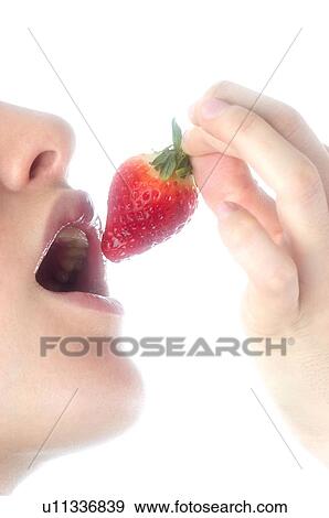 Stock Photo - Woman, Brown Hair, Beauty, Eating, Fruit, Strawberry, Mouth. Fotosearch