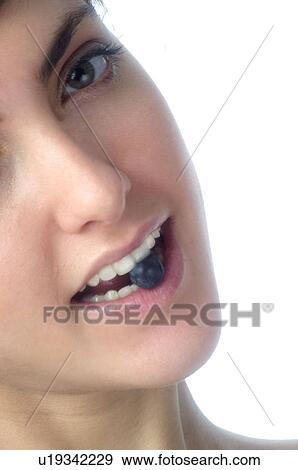 Woman, Brown Hair, Beauty, Eating, Fruit, Blueberry, Mouth View Large Photo Image Stock Photo - Woman, Brown Hair, Beauty, Eating, Fruit, Blueberry, Mouth. Fotosearch