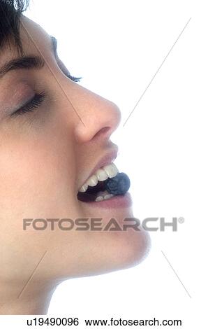 Woman, Brown Hair, Beauty, Eating, Fruit, Blueberry, Mouth View Large Photo Image Stock Photograph - Woman, Brown Hair, Beauty, Eating, Fruit, Blueberry, Mouth. Fotosearch