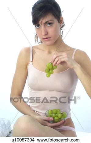 Woman, Brown Hair, Beauty, White undershit, Eating, Fruit, Grapes View Large Photo Image Picture - Woman, Brown Hair, Beauty, White undershit, Eating, Fruit, Grapes. Fotosearch