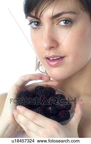 Woman, Brown Hair, Beauty, White undershit, Eating, Fruit, Mulberry View Large Photo Image Picture - Woman, Brown Hair, Beauty, White undershit, Eating, Fruit, Mulberry. Fotosearch