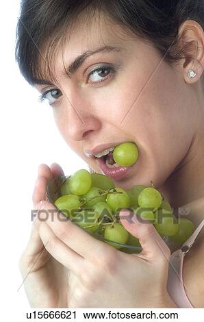 Woman, Brown Hair, Beauty, White undershit, Eating, Fruit, Grapes View Large Photo Image Stock Image - Woman, Brown Hair, Beauty, White undershit, Eating, Fruit, Grapes. Fotosearch