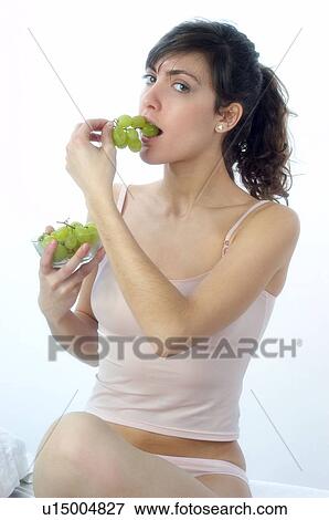 Woman, Brown Hair, Beauty, White undershit, Eating, Fruit, Grapes View Large Photo Image Stock Photo - Woman, Brown Hair, Beauty, White undershit, Eating, Fruit, Grapes. Fotosearch