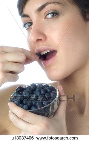 Woman, Brown Hair, Beauty, White undershit, Eating, Fruit, Blueberry View Large Photo Image Stock Photograph - Woman, Brown Hair, Beauty, White undershit, Eating, Fruit, Blueberry. Fotosearch