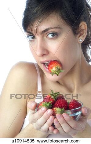 Woman, Brown Hair, Beauty, White undershit, Eating, Fruit, Strawberry View Large Photo Image Stock Photography - Woman, Brown Hair, Beauty, White undershit, Eating, Fruit, Strawberry. Fotosearch