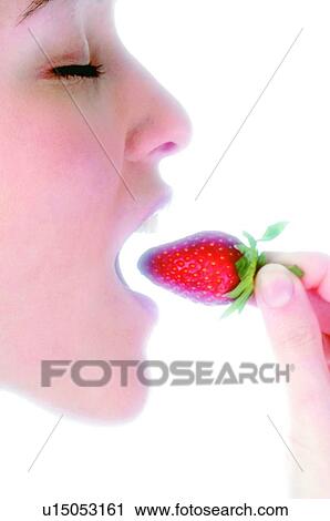 Stock Image - Woman, Beauty, Eating, Fruit, Strawberry, Mouth, Opening mouth. Fotosearch