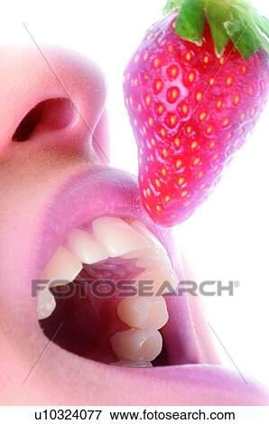 Stock Photo - Woman, Beauty, Eating, Fruit, Strawberry, Mouth, Opening mouth. Fotosearch