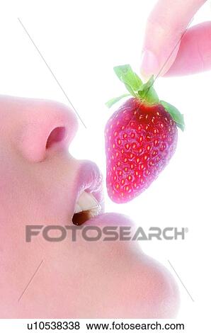 Stock Photo - Woman, Beauty, Eating, Fruit, Strawberry, Mouth, Opening mouth. Fotosearch