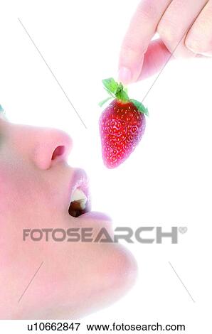 Stock Photo - Woman, Beauty, Eating, Fruit, Strawberry, Mouth, Opening mouth. Fotosearch