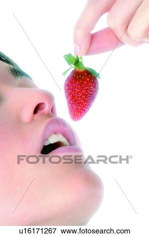 Stock Photo - Woman, Beauty, Eating, Fruit, Strawberry, Mouth, Opening mouth. Fotosearch
