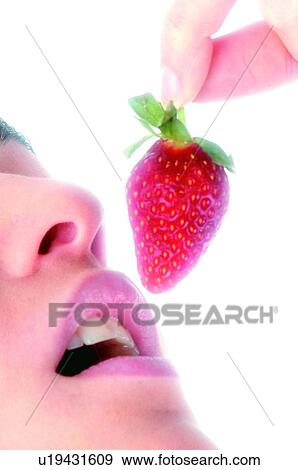 Stock Photo - Woman, Beauty, Eating, Fruit, Strawberry, Mouth, Opening mouth. Fotosearch