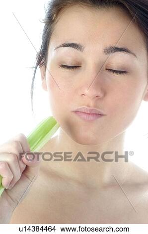 Picture - Woman, Beauty, Eating, Vegetable, Leek, Mouth, Opening mouth. Fotosearch