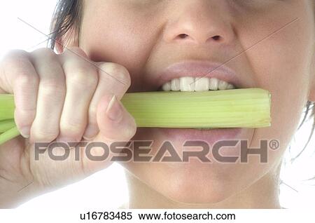 Stock Photography - Woman, Beauty, Eating, Vegetable, Leek, Mouth, Opening mouth. Fotosearch