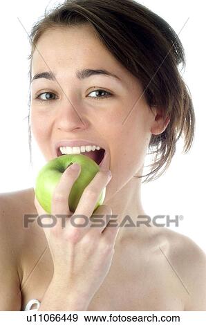 Stock Photo - Woman, Beauty, Smiling, Fruit, Apple, Mouth, Face. Fotosearch