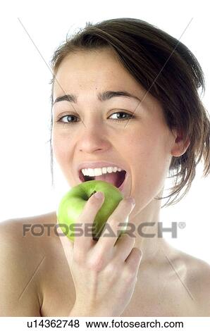 Stock Photo - Woman, Beauty, Smiling, Fruit, Apple, Mouth, Face. Fotosearch