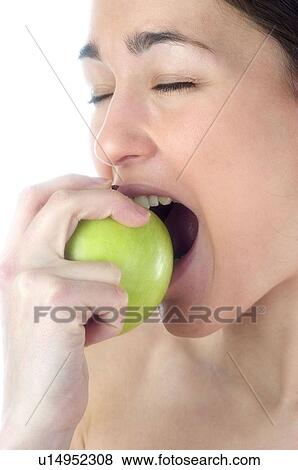 Stock Photo - Woman, Beauty, Smiling, Fruit, Apple, Mouth, Face. Fotosearch