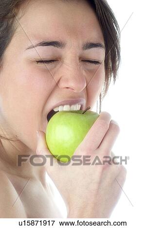 Stock Photo - Woman, Beauty, Smiling, Fruit, Apple, Mouth, Face. Fotosearch