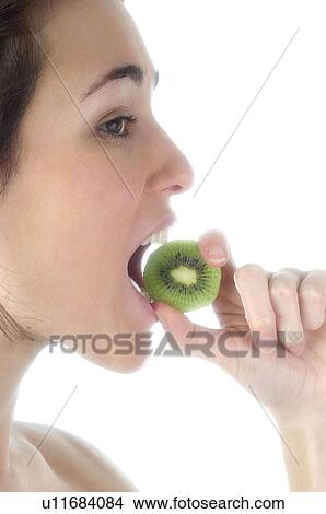 Woman, Beauty, Smiling, Fruit, Kiwi, Mouth, Face View Large Photo Image Picture - Woman, Beauty, Smiling, Fruit, Kiwi, Mouth, Face. Fotosearch