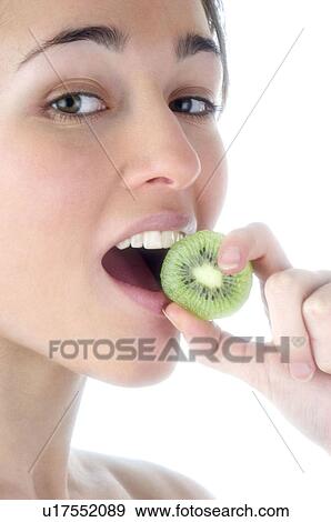 Stock Photo - Woman, Beauty, Smiling, Fruit, Kiwi, Mouth, Face. Fotosearch