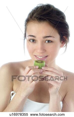 Stock Photography - Woman, Beauty, Smiling, Fruit, Kiwi, Mouth, Face. Fotosearch