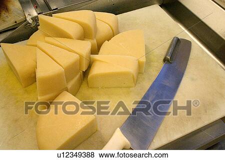 Wedges of freshly cut Parmesan Cheese View Large Photo Image Stock Photo - Wedges of freshly cut Parmesan Cheese. Fotosearch