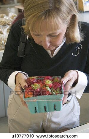 Woman holding strawberries View Large Photo Image Stock Image - Woman holding strawberries. Fotosearch