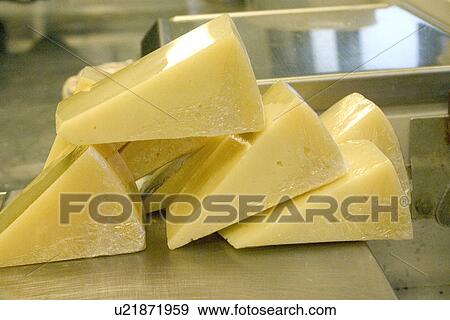 Wrapped wedges of Parmesan Cheese View Large Photo Image Stock Photo - Wrapped wedges of Parmesan Cheese. Fotosearch