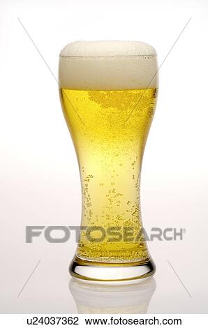 A glass of beer with froth on top View Large Photo Image Stock Image - A glass of beer with froth on top. Fotosearch