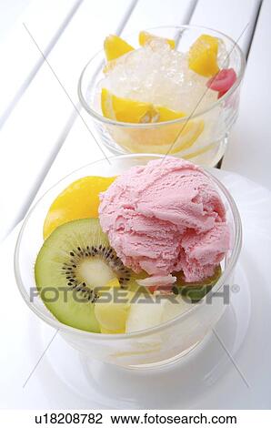 Stock Image - Bowl of ice cream and fruits. Fotosearch